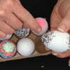 Angie Vangelis decorates plastic eggs